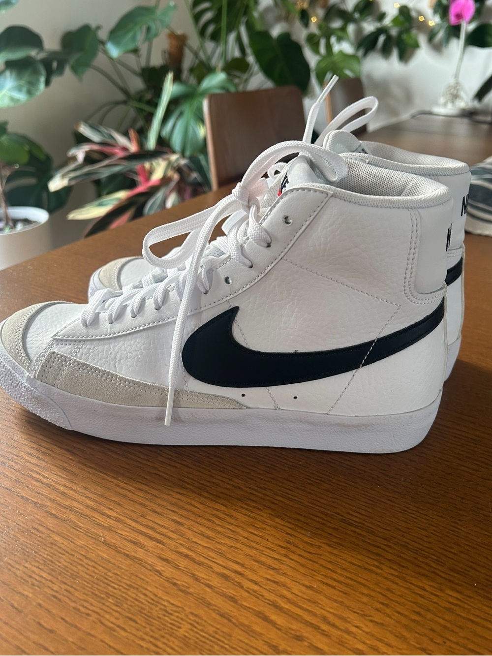 Nike White High-Top Sneakers with Black Swoosh